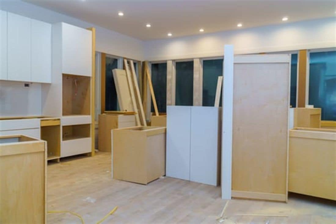 Interior home renovation in progress with new cabinetry and finish work underway