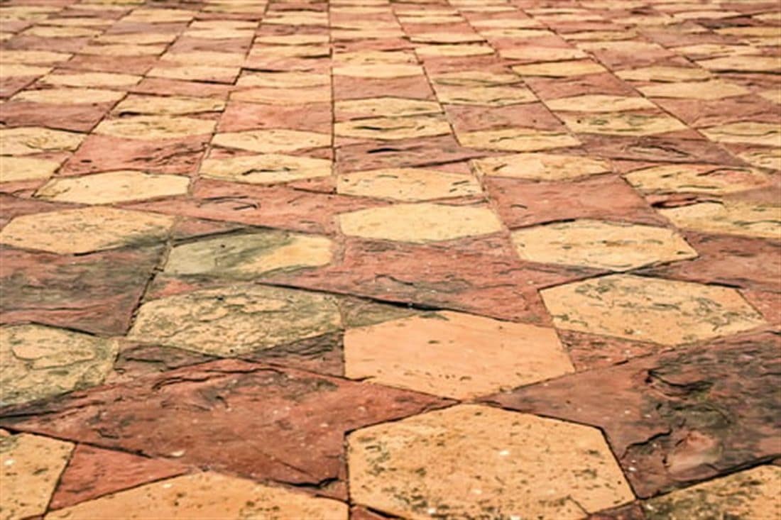 Stamped concrete patio surface with a stone pattern and integral color finish